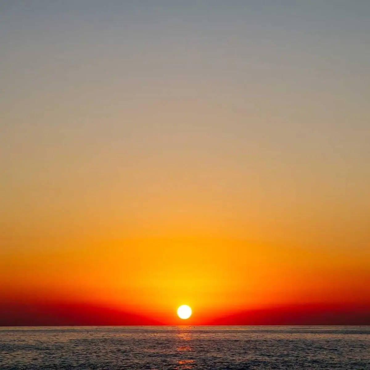 Sunset boat tour with golden sea views along Himara Coast