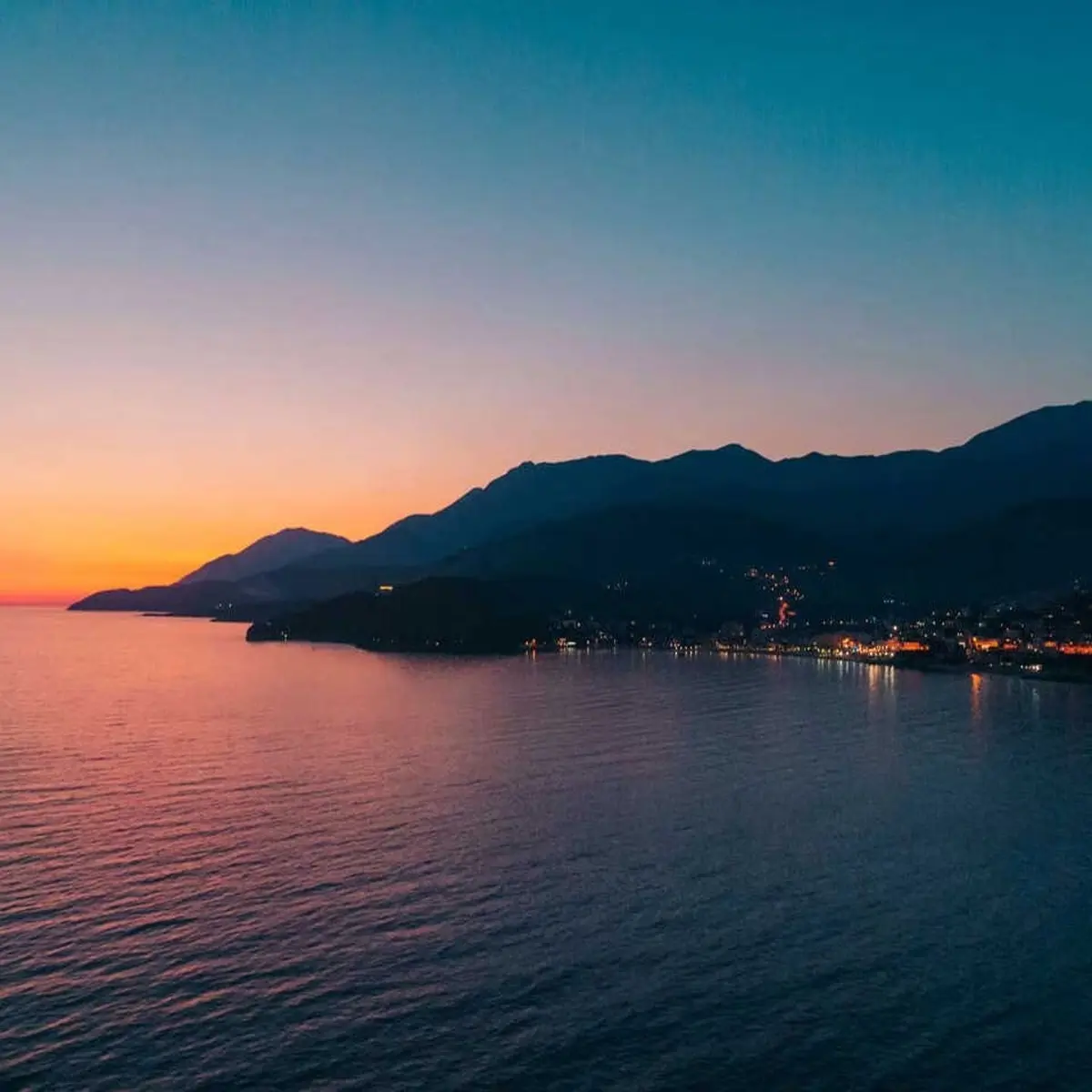 Sunset boat tour with golden sea views along Himara Coast
