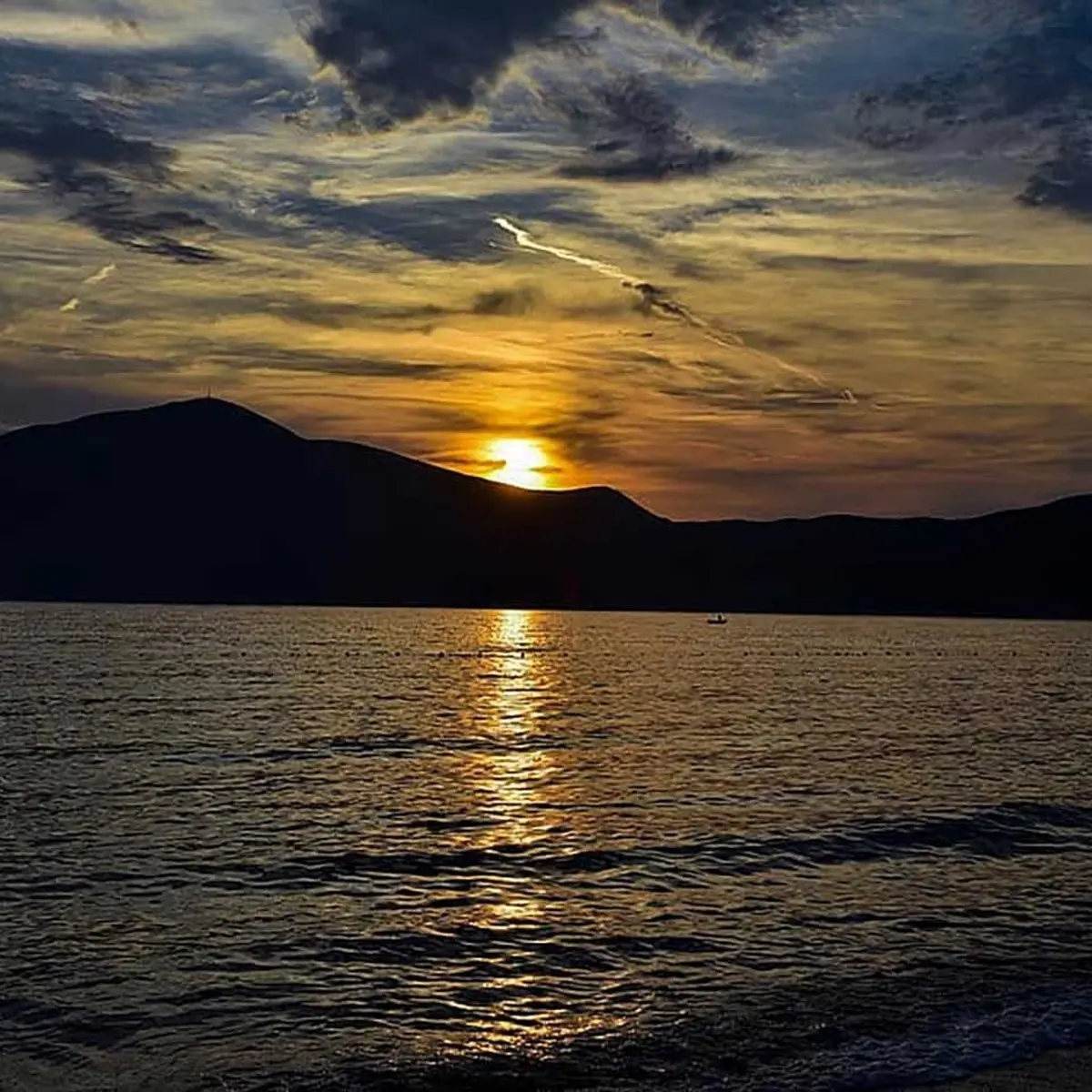 Sunset boat tour with golden sea views along Himara Coast